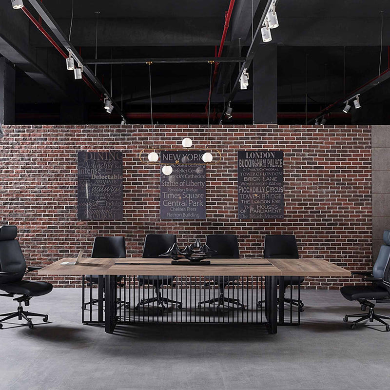Vantage 2400 Boardroom Table in a boardroom setting with Warm Oak top and black base