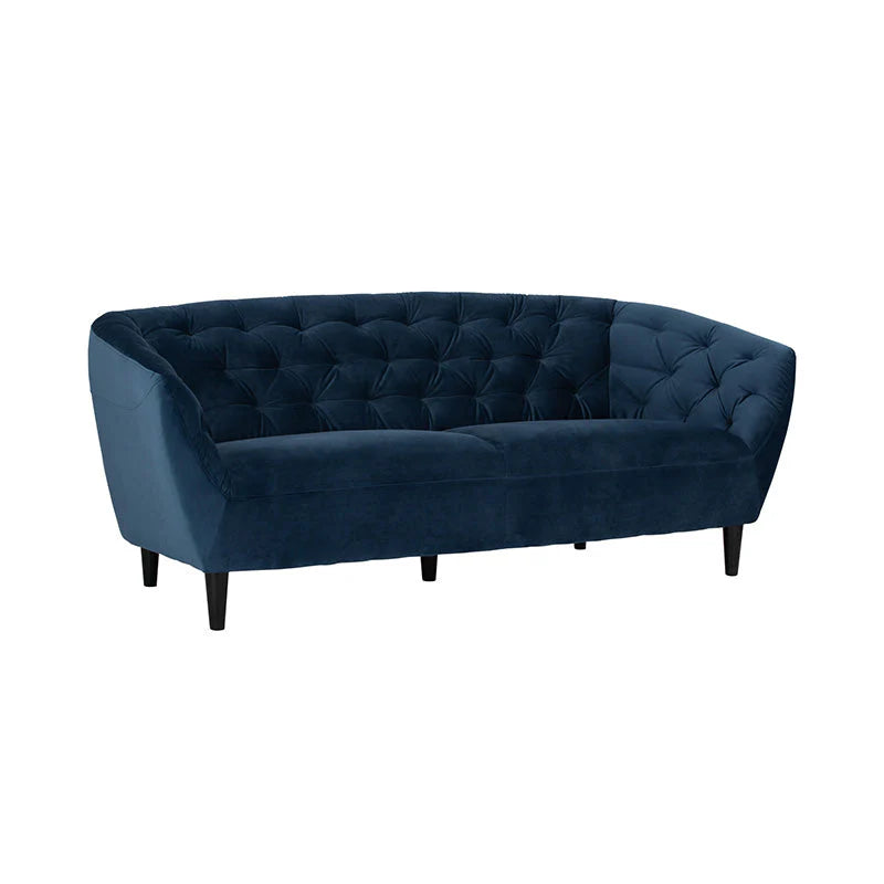 Blue velvet 3 seater sofa styled in a lounge room setting