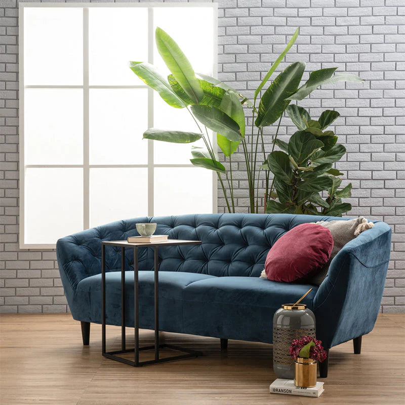 Blue velvet 3 seater sofa in modern room setting